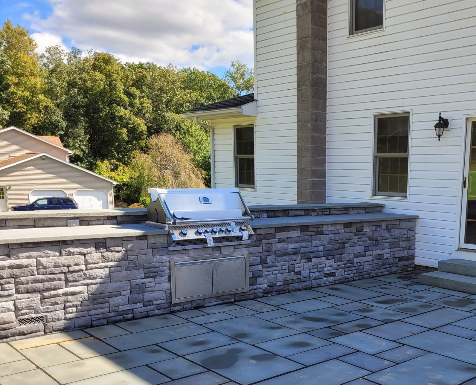 Backyard patio with built-in grill.