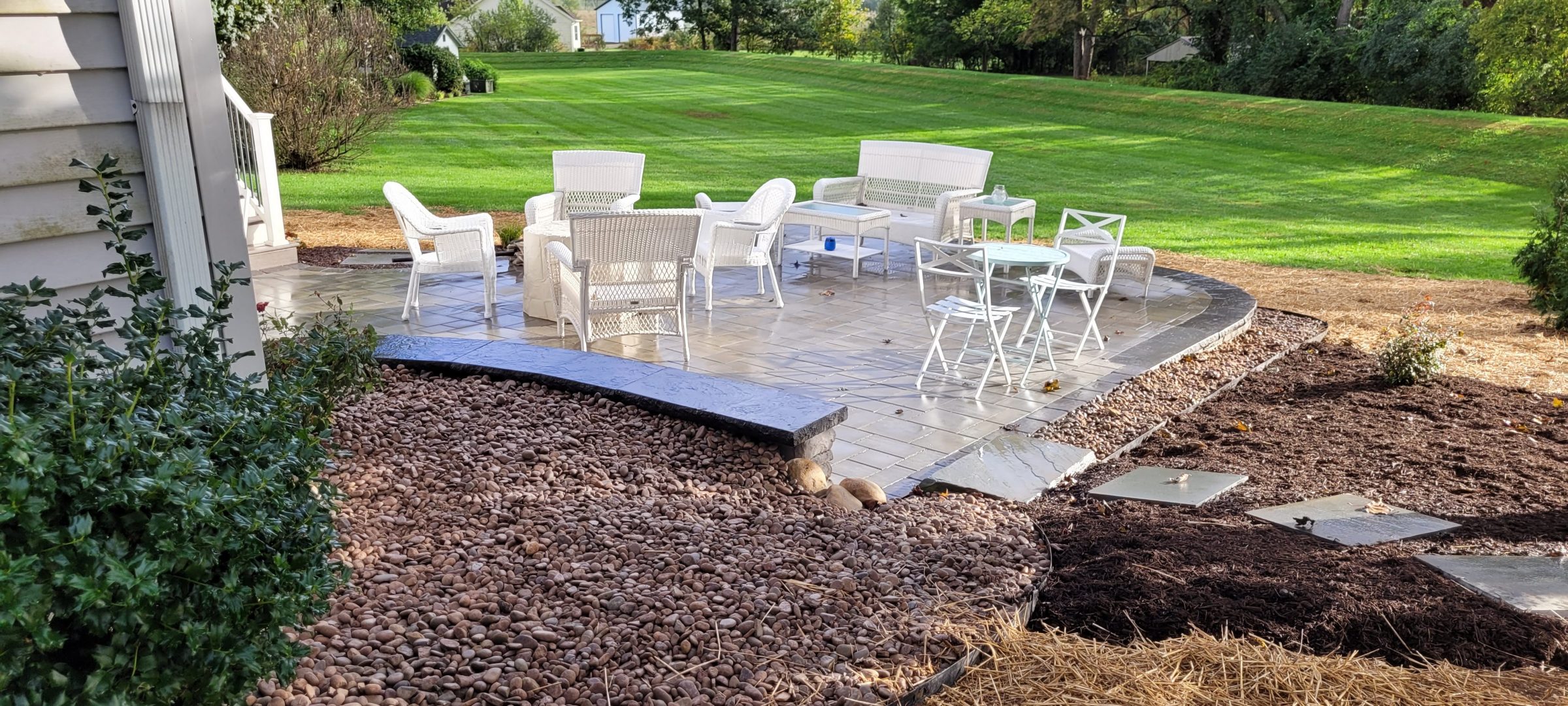 Patio with white furniture on sunny day