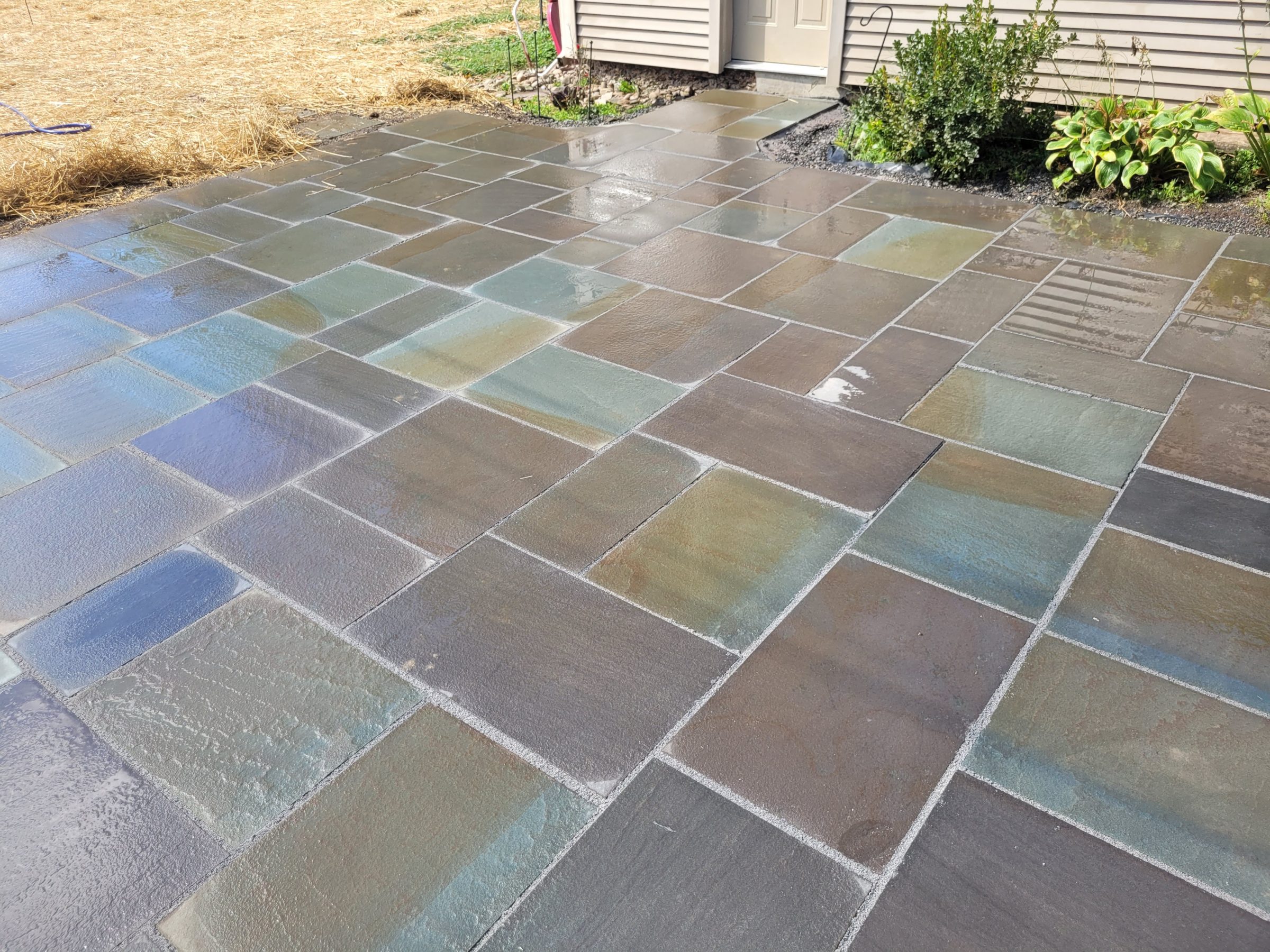 Colorful stone patio with wet surface
