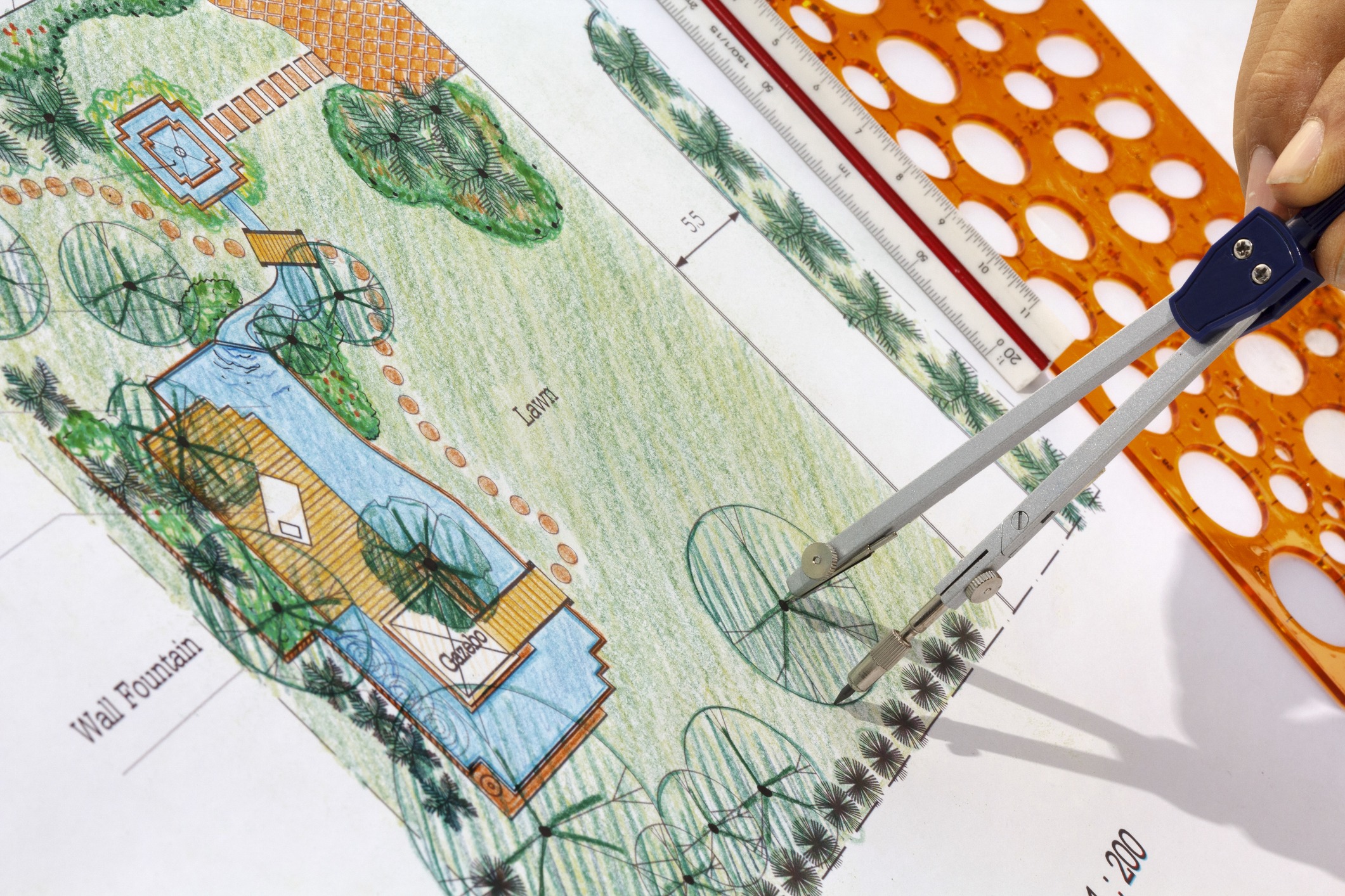 Landscape design plan with measuring tools.